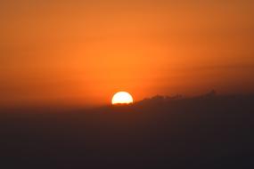 the evening sun sets over the horizon in Salvador