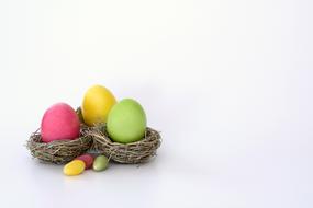 decoration of multicolored easter eggs in nests