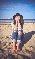 photo of a girl with a closed face on the beach