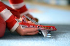 Toy Aircraft in hands of child