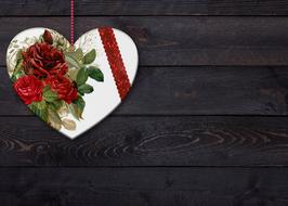 heart with flowers on wooden background