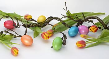 easter decoration with painted eggs and tulips