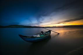 lonely old boat on the evening sea