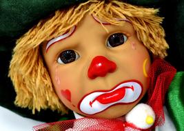 Portrait of the colorful clown doll with colorful make-up