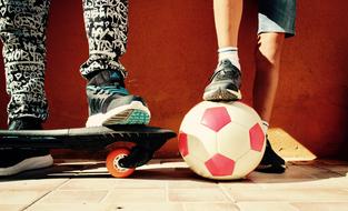 boys with ball and skateboard