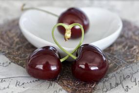 Beautiful, red, shiny cherries in heart shape
