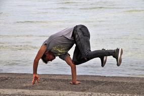 guy dancing hip hop on the shore of bodensee lake