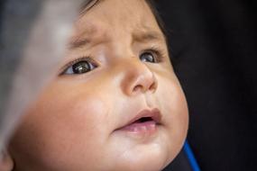 sad Baby boy face close up
