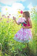 pretty Child Girl among flowers