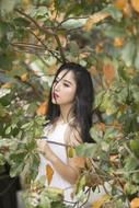 Girl In orange green Forest