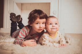 two brothers laying on floor, Baby and child boys