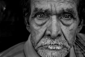 Portrait of serious unshaven mature man