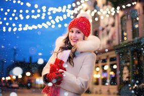 girl in a Christmas motif in the middle of the street