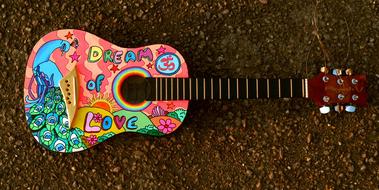 Beautiful and colorful guitar on the ground