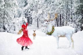 Winter Little Girl Dancing and white deer