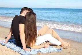 couple in love is resting on the ocean