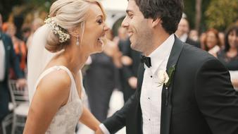 photo of cheerful bride and groom