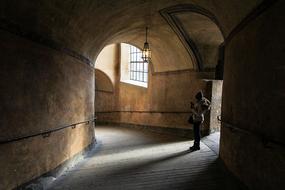 photo of a woman in the tunnel of the monastery