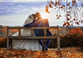 Wedding people sunset and orange leaves