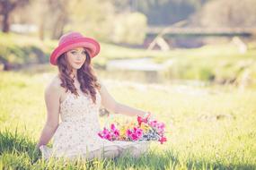 woman on the field with flower basket