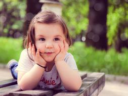 photo of a dreaming girl on a bench