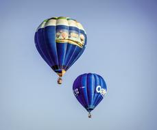 two blue hot air balloons