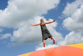 Girl Jumping white sky