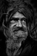 portrait of Homeless mature man with long hair