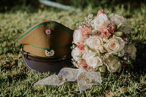 bridal bouquet and policeman cap