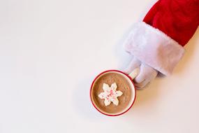 Santa Claus hand and hot chocolate