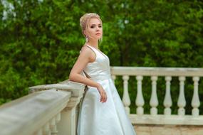 proud bride on a white terrace