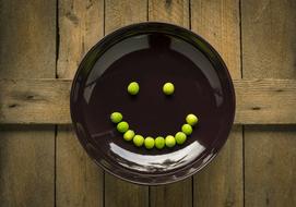 peas on the black plate