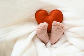 Love heart and baby feet