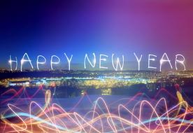 happy new year, light writing at night cityscape