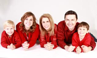 portrait of family members in red sweaters