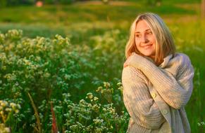 cheerful woman on the field