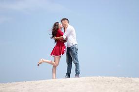 photo of a couple in love on the sand dunes