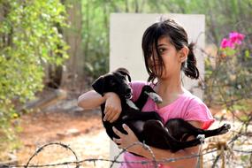 Girl Child with small dog