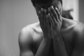 black and white photo of a guy with a closed face