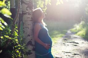 pregnant woman in forest