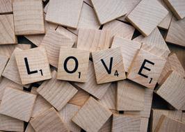 Love, Scrabble Word on pile of wooden bricks