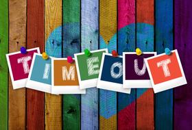 Timeout, colorful cards with letters on painted wooden planks
