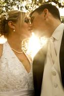 Bride and groom kissing outdoor