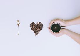 Coffee Beans and Spoon and hands