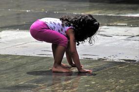 Little Girl play fountain