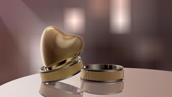 two wedding rings and a heart