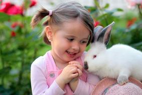 little girl and cute white rabbit