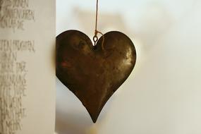 metal heart hanging on a thread
