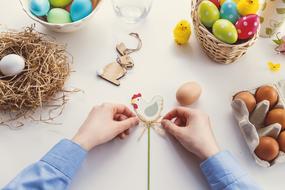 person decorating Easter Eggs