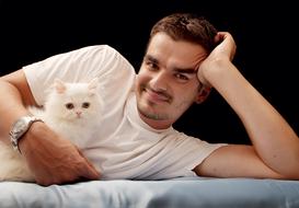 man with white fluffy cat